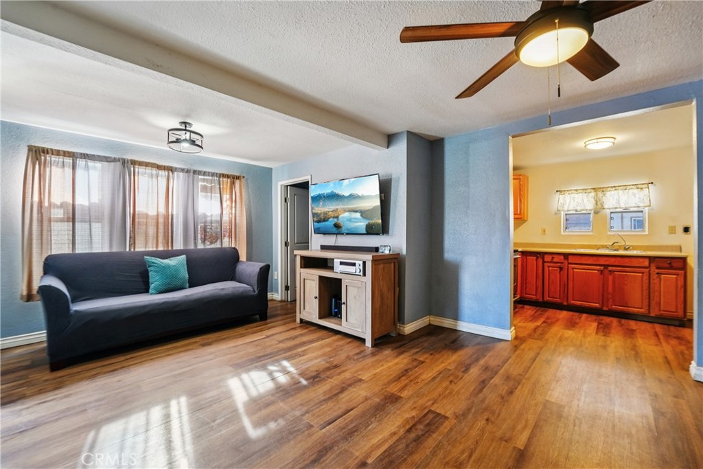 313 North 3rd Street Banning, CA 92220 - Photo 21 of 30 a living room with furniture and a wooden floor