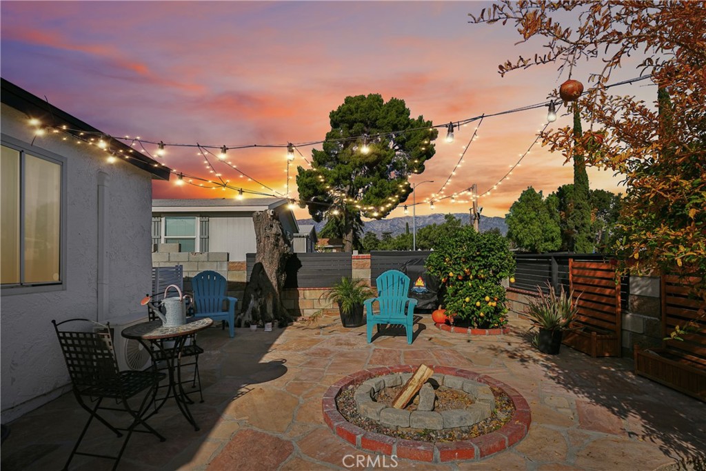 313 North 3rd Street Banning, CA 92220 - Photo 4 of 30 a backyard of a house with table and chairs