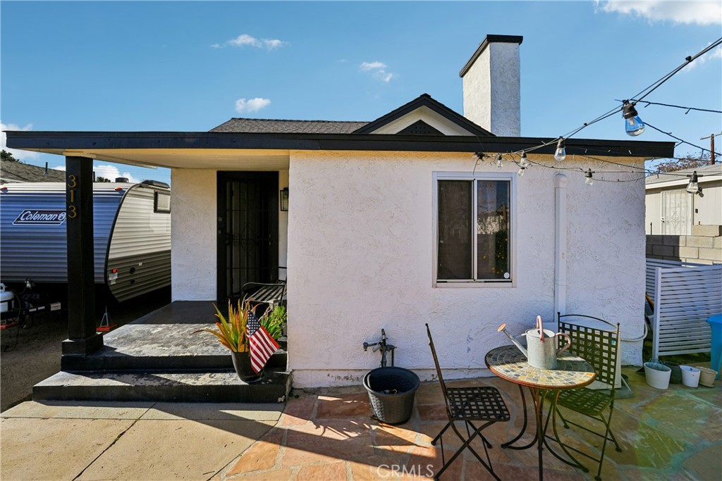 313 North 3rd Street Banning, CA 92220 - Photo 7 of 30 a front view of a house with chairs