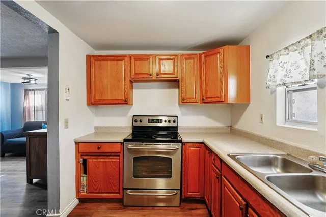 a kitchen with a stove and a sink
