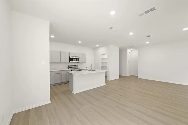 a view of kitchen with wooden floor
