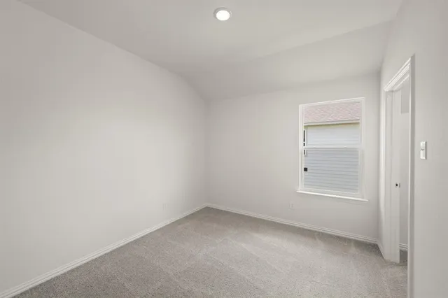 an empty room with a empty space and windows