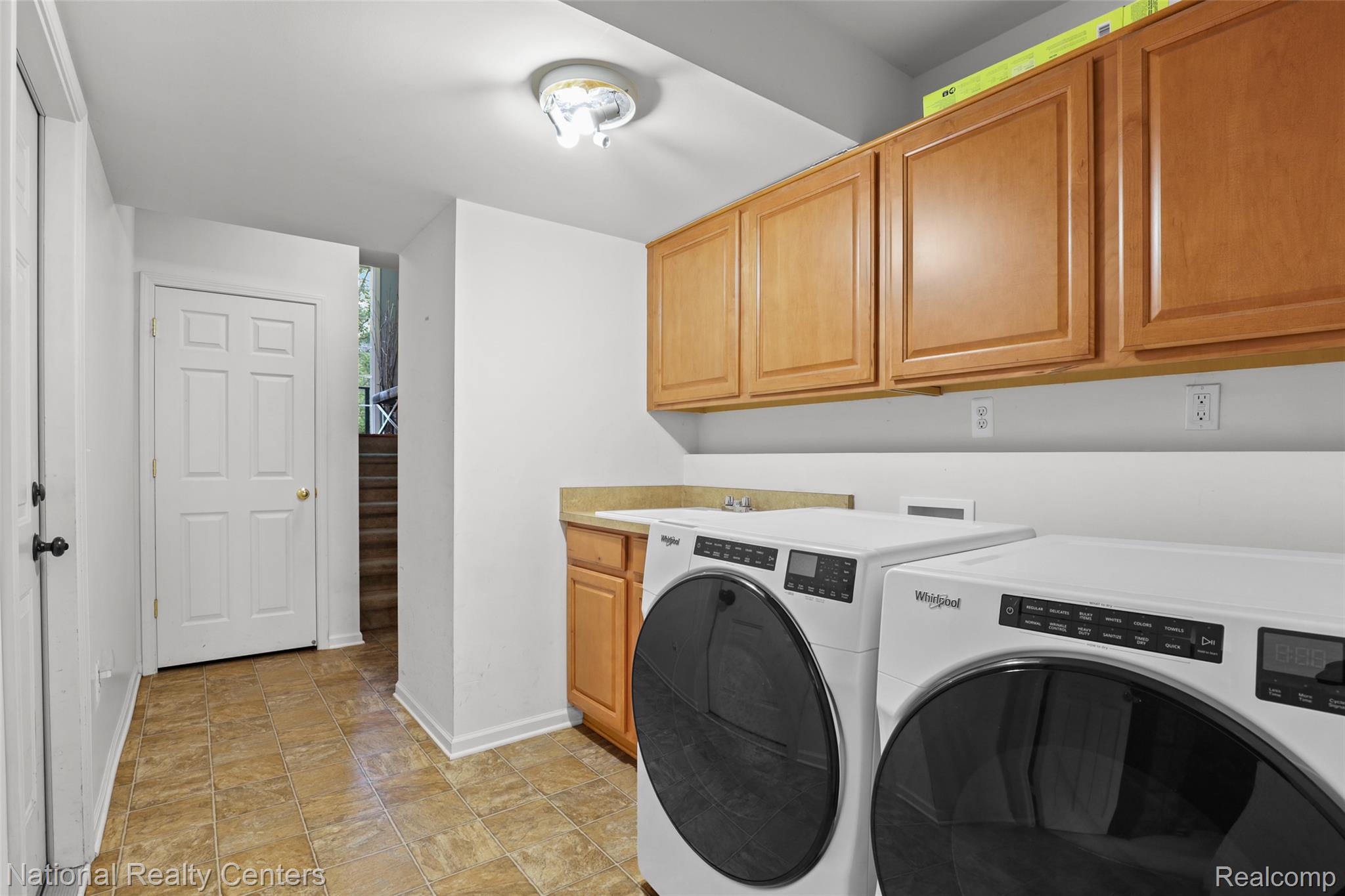 779 Red Run Drive Troy, MI 48085 - Photo 23 of 32 Laundry Room with Garage to the left.