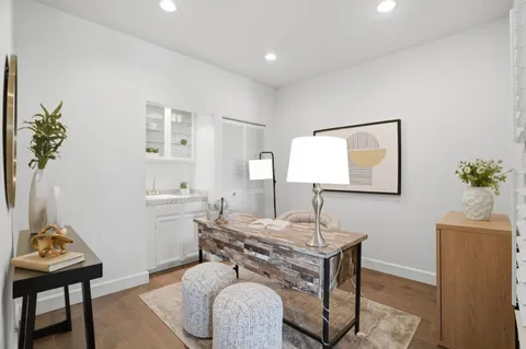 a bedroom with a bed and a couch