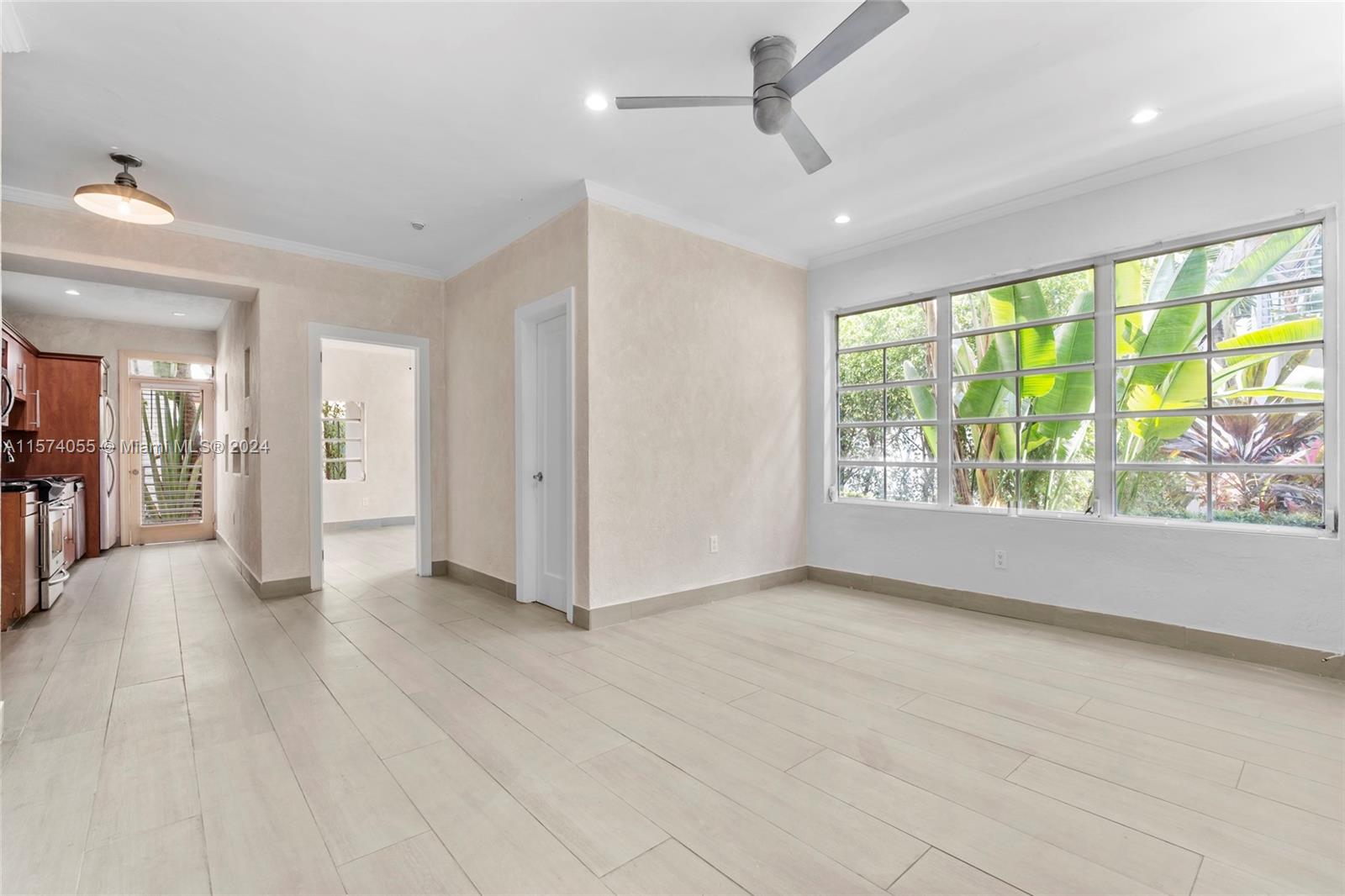 934 16th Street, Unit 5 Miami Beach, FL 33139 - Photo 1 of 22 a view of livingroom with hardwood floor and ceiling fan