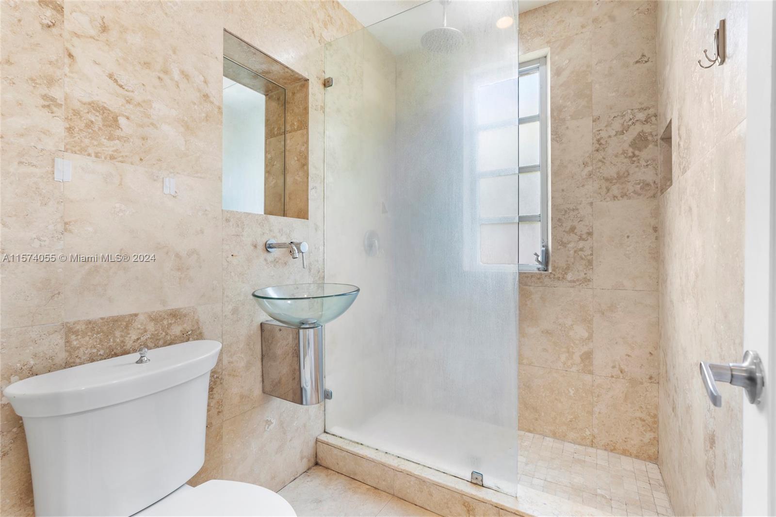 934 16th Street, Unit 5 Miami Beach, FL 33139 - Photo 14 of 22 a bathroom with a sink toilet and shower