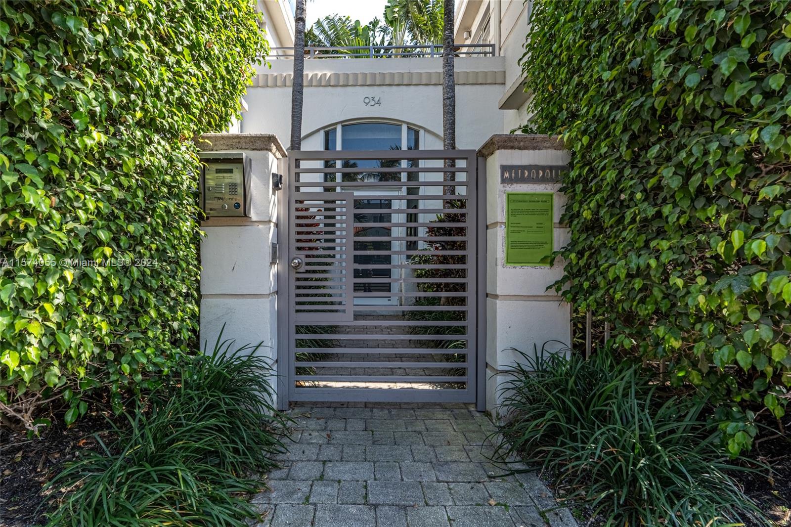 934 16th Street, Unit 5 Miami Beach, FL 33139 - Photo 18 of 22 a front view of a house with a yard