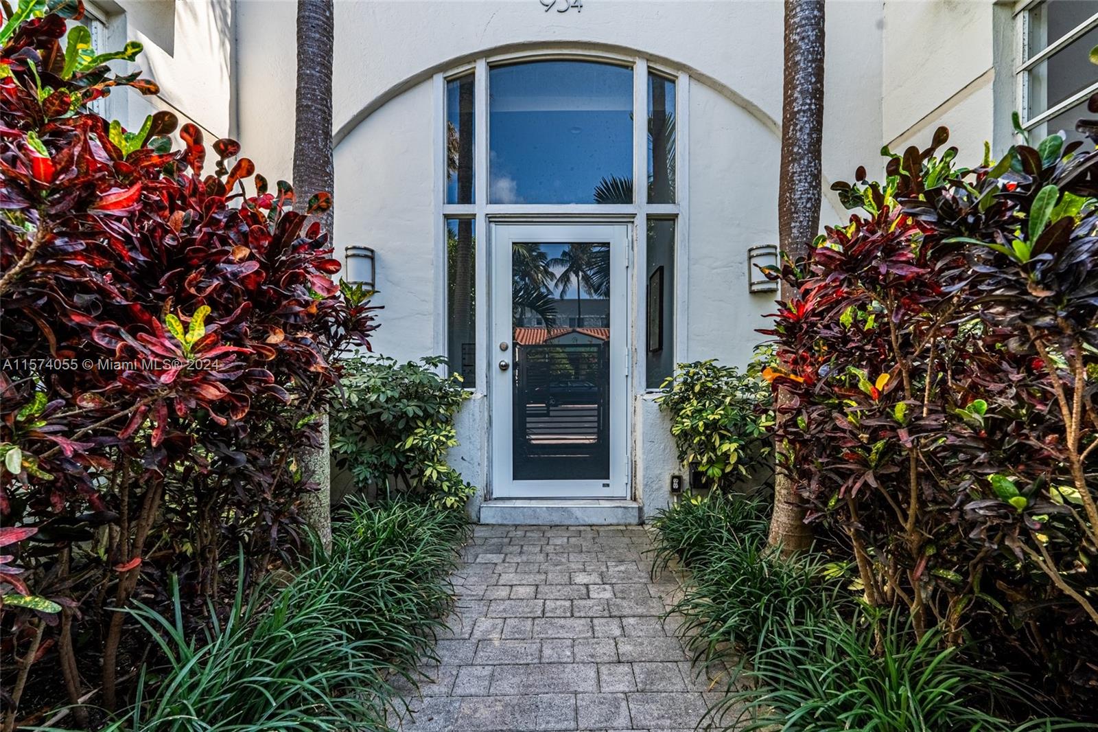 934 16th Street, Unit 5 Miami Beach, FL 33139 - Photo 19 of 22 a view of a pathway of the house with potted plants