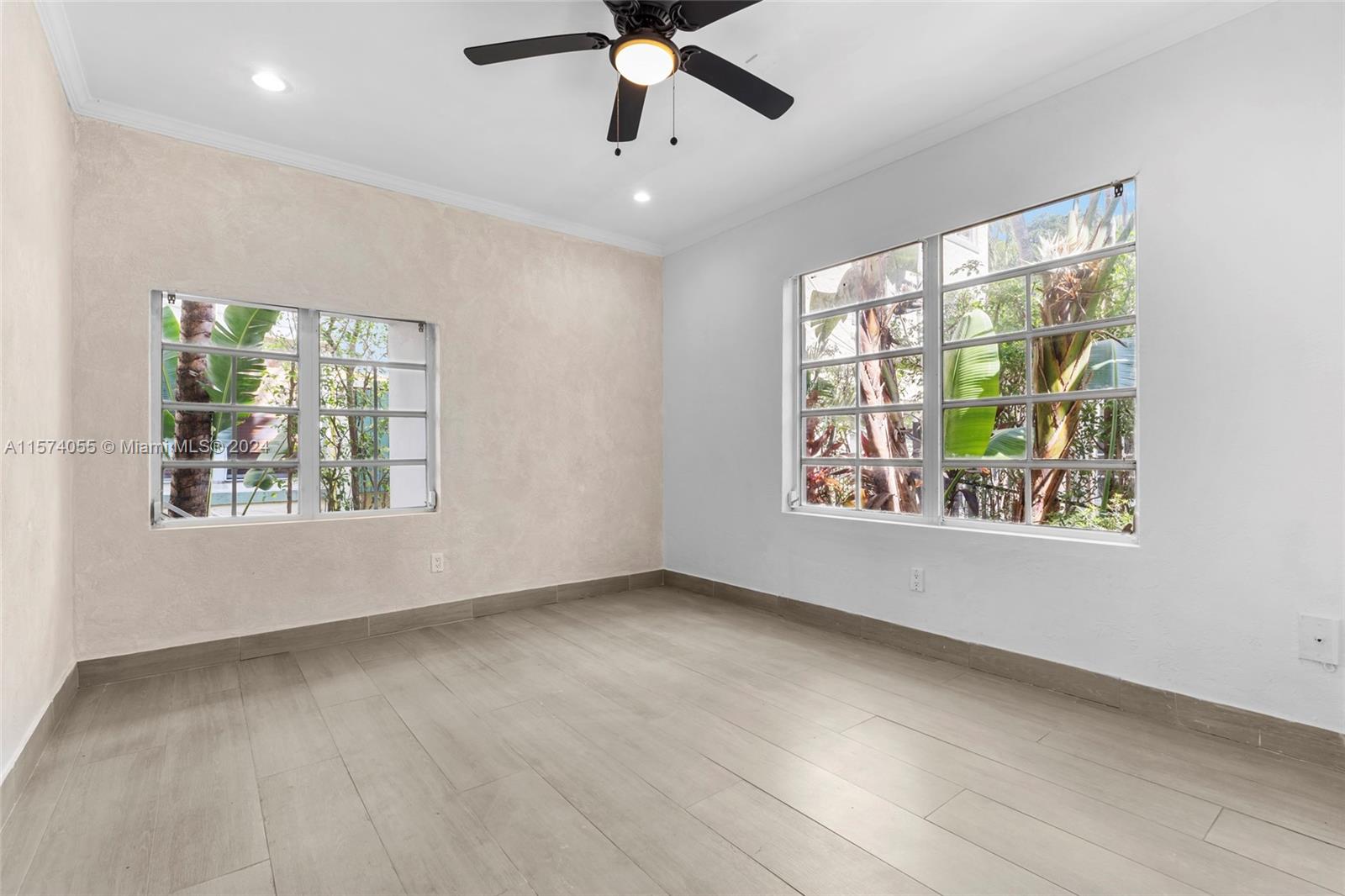 934 16th Street, Unit 5 Miami Beach, FL 33139 - Photo 10 of 22 a view of an empty room with a window