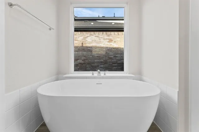a white bath tub sitting in a bathroom