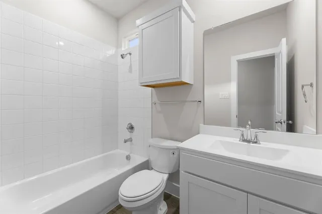 a bathroom with a sink a toilet and a bathtub