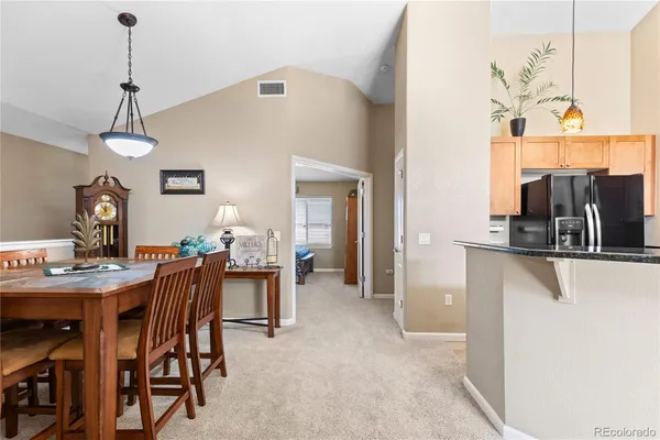 a view of living room with furniture and a fireplace