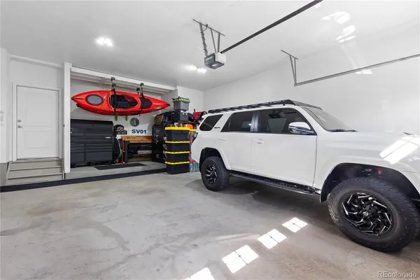 a view of a garage and car parked