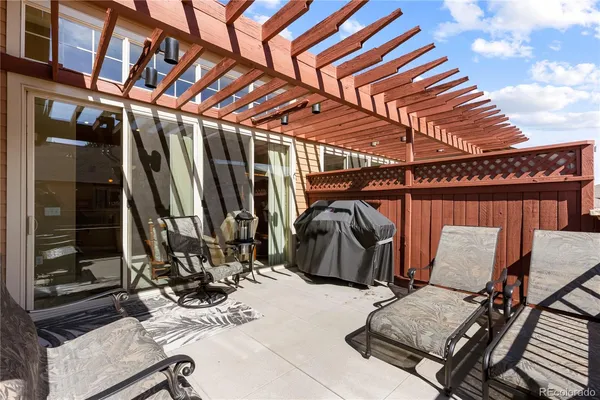 a terrace of a house with outdoor seating