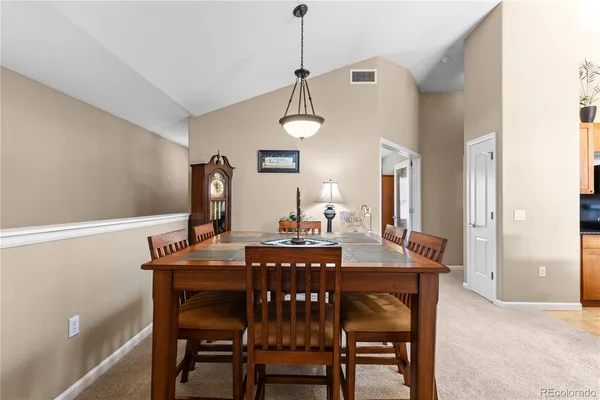 a view of a dining room and a livingroom with furniture