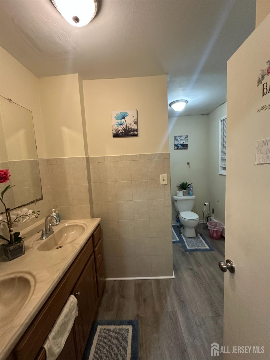 2 Ball Street New Brunswick, NJ 08901 - Photo 11 of 18 a bathroom with a sink and mirror