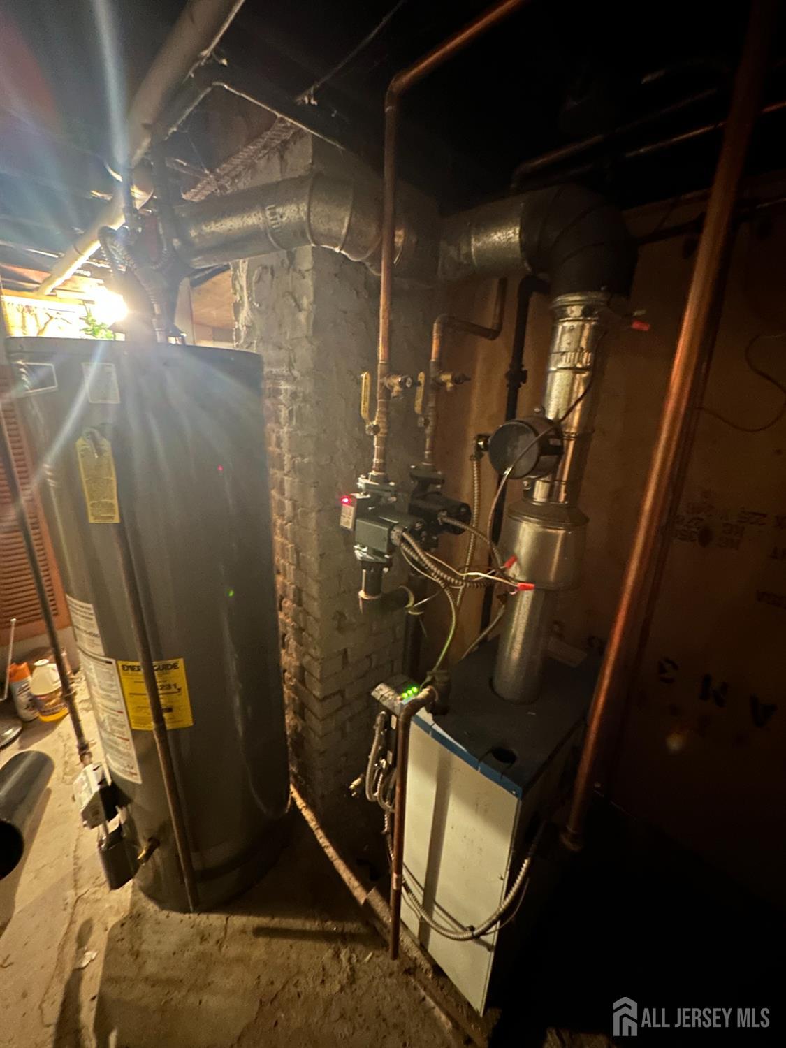 2 Ball Street New Brunswick, NJ 08901 - Photo 16 of 18 a room with water heater and wooden door