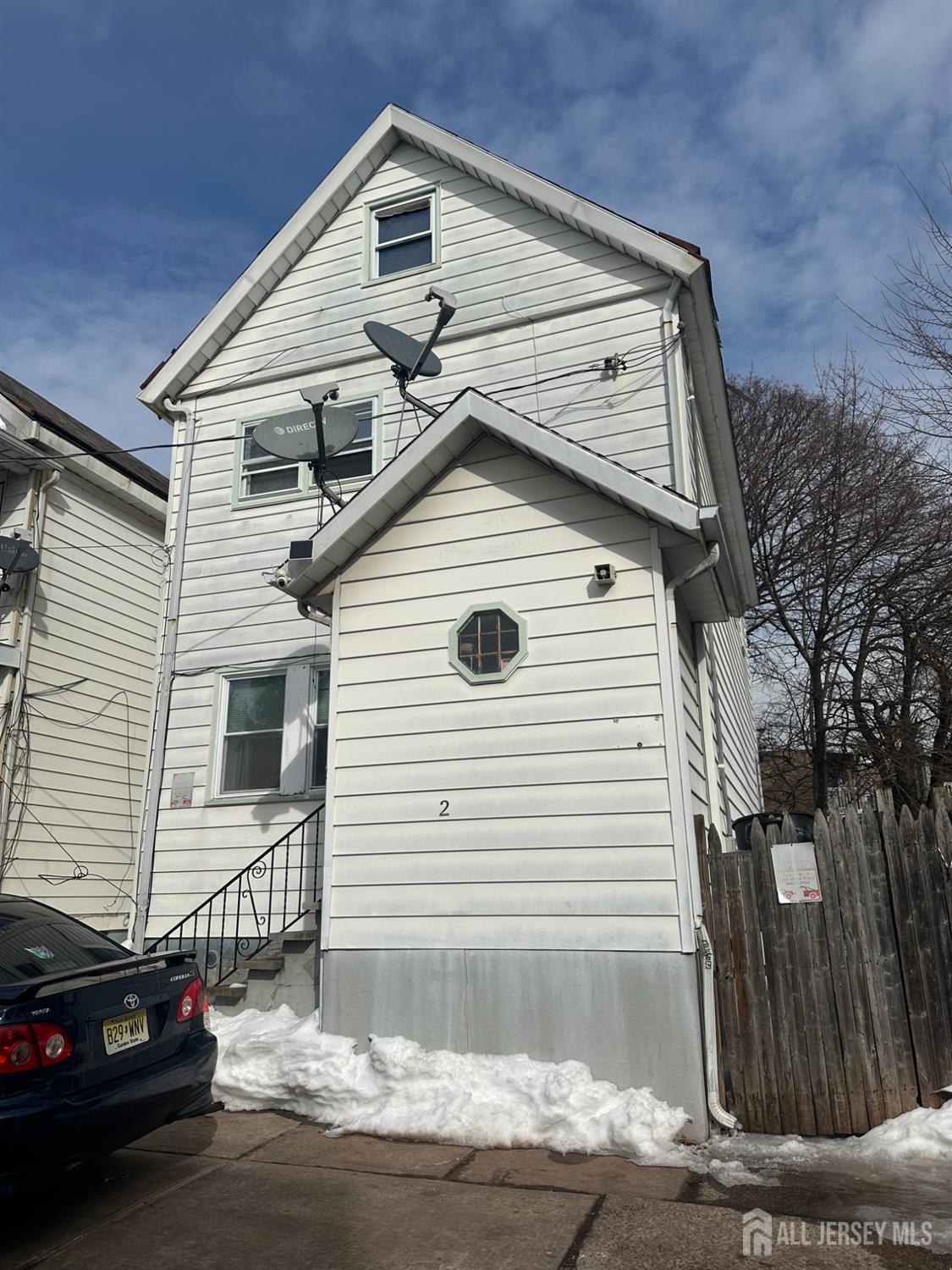 2 Ball Street New Brunswick, NJ 08901 - Photo 2 of 18 a view of a house with a wooden fence