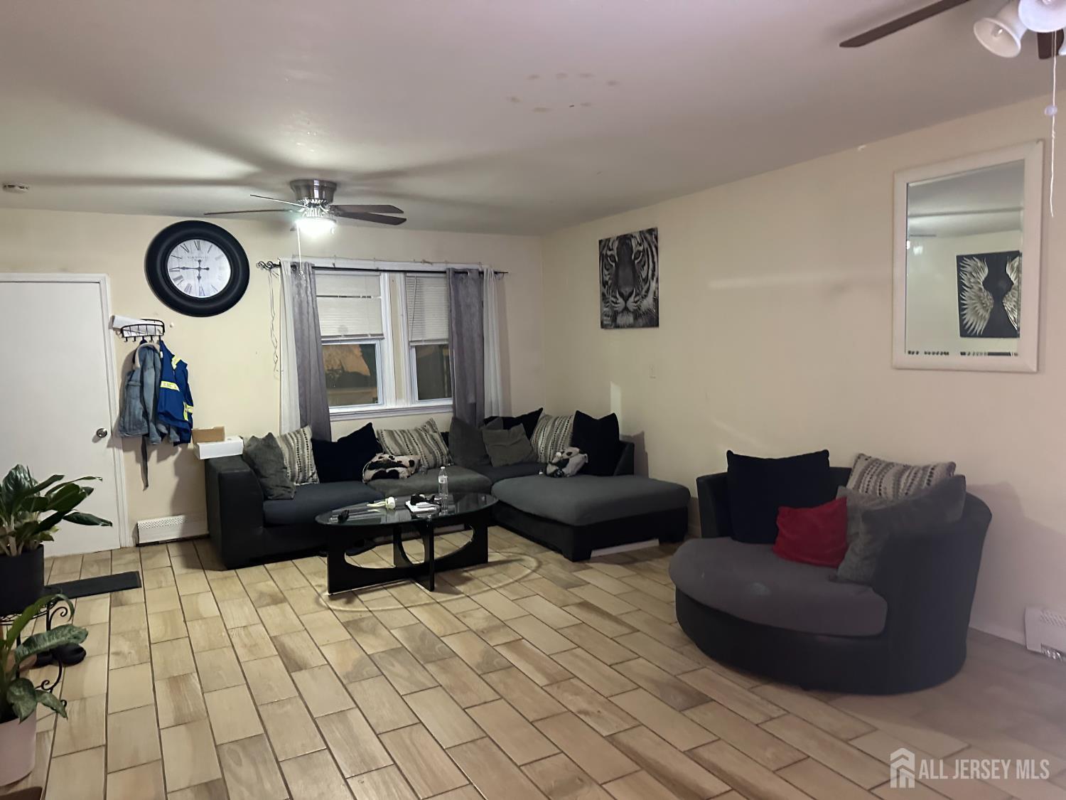 2 Ball Street New Brunswick, NJ 08901 - Photo 5 of 18 a living room with furniture and a mirror