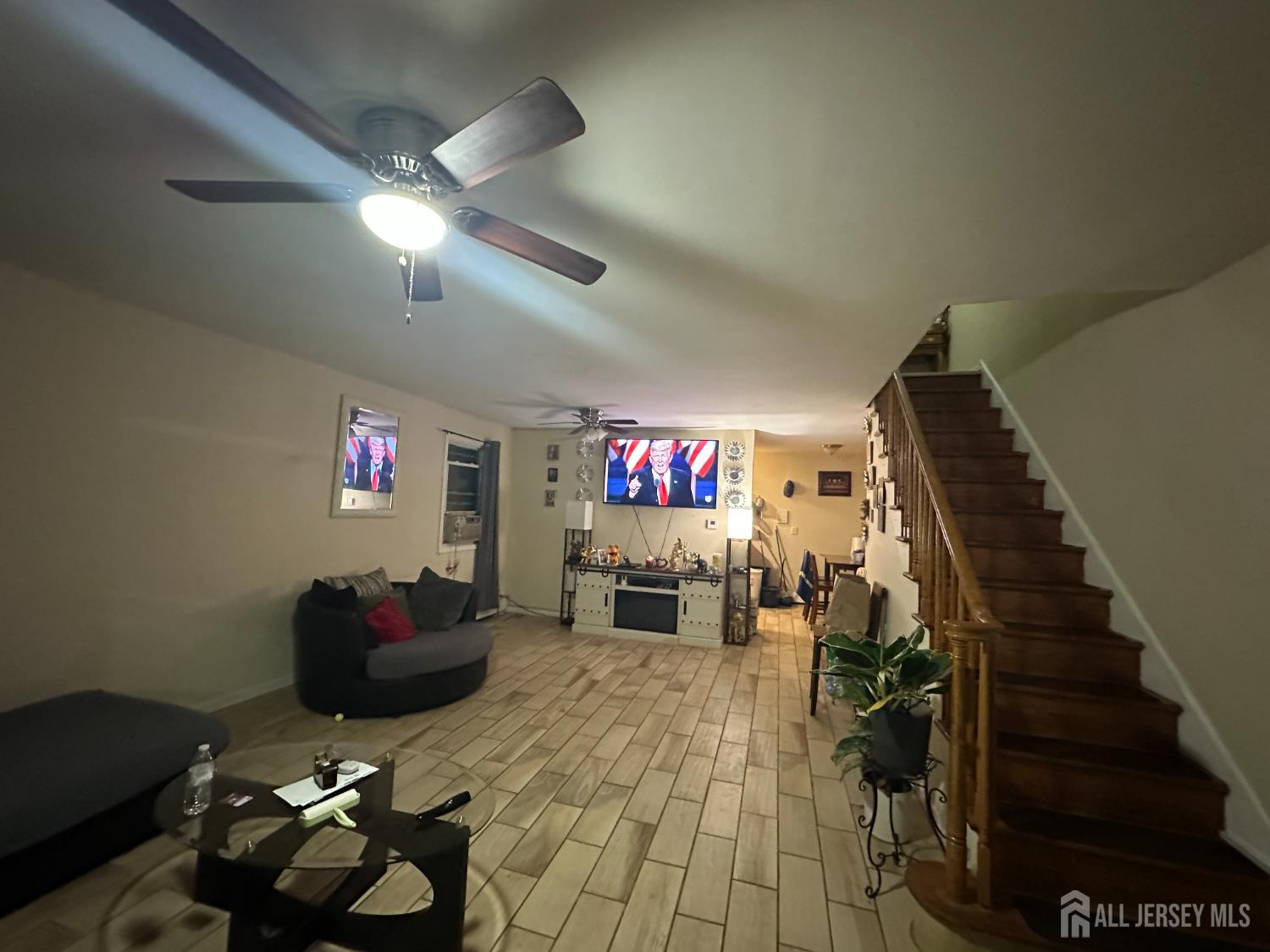 2 Ball Street New Brunswick, NJ 08901 - Photo 6 of 18 a living room with furniture and a flat screen tv
