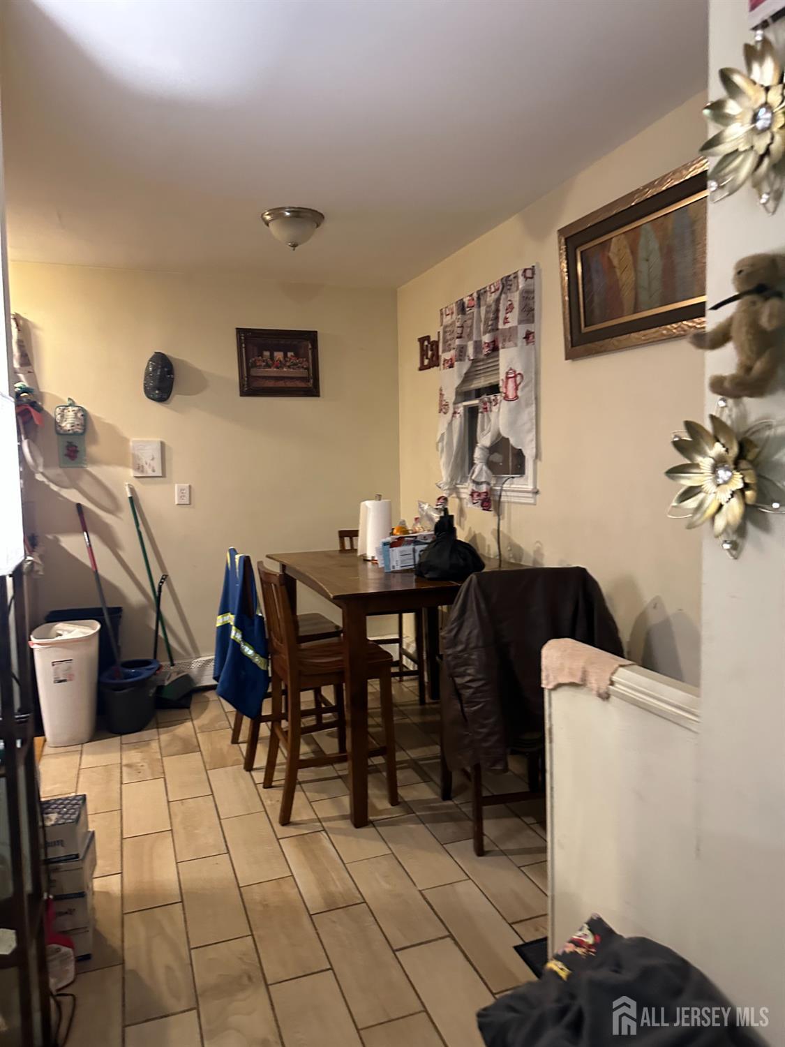 2 Ball Street New Brunswick, NJ 08901 - Photo 9 of 18 a living room with furniture a flat screen tv and kitchen view
