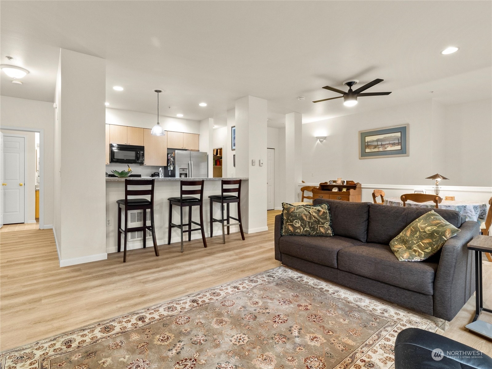 5100 Talbot Place South, Unit A Renton, WA 98055 - Photo 2 of 15 a living room with furniture and kitchen view
