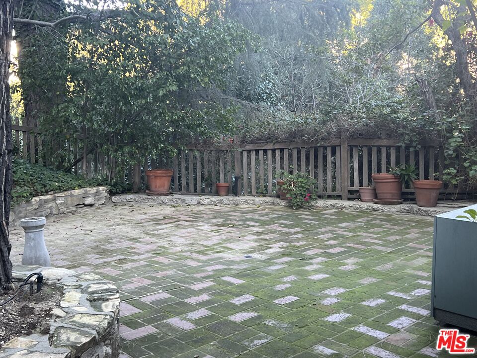 14807 Round Valley Drive Sherman Oaks, CA 91403 - Photo 11 of 25 a view of backyard with wooden fence and trees