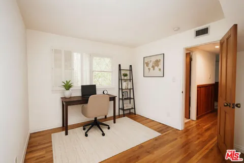 a workspace with furniture and a window