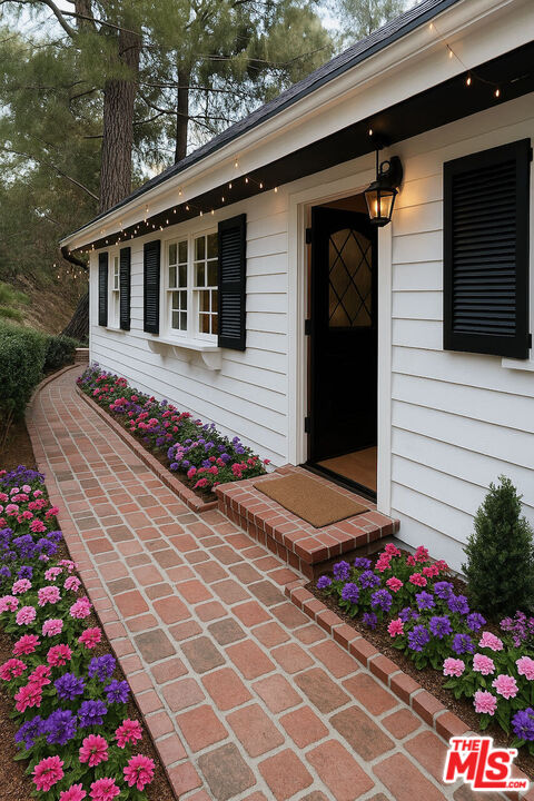 14807 Round Valley Drive Sherman Oaks, CA 91403 - Photo 16 of 25 a picture of flowers and a table