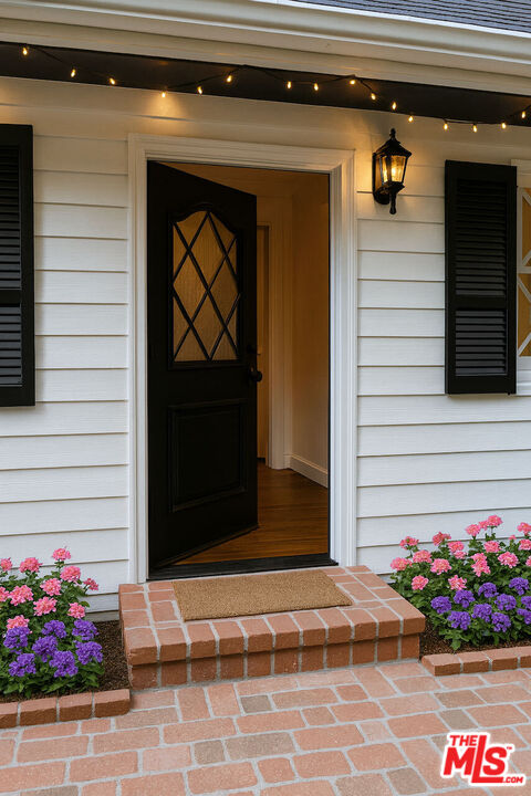 14807 Round Valley Drive Sherman Oaks, CA 91403 - Photo 18 of 25 a view of front door of house and flowers