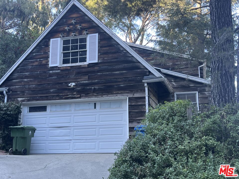14807 Round Valley Drive Sherman Oaks, CA 91403 - Photo 21 of 25 a front view of a house with garage