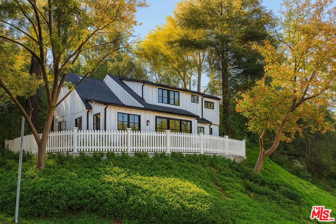 14807 Round Valley Drive Sherman Oaks, CA 91403 - Photo 3 of 25 a front view of a house with a garden