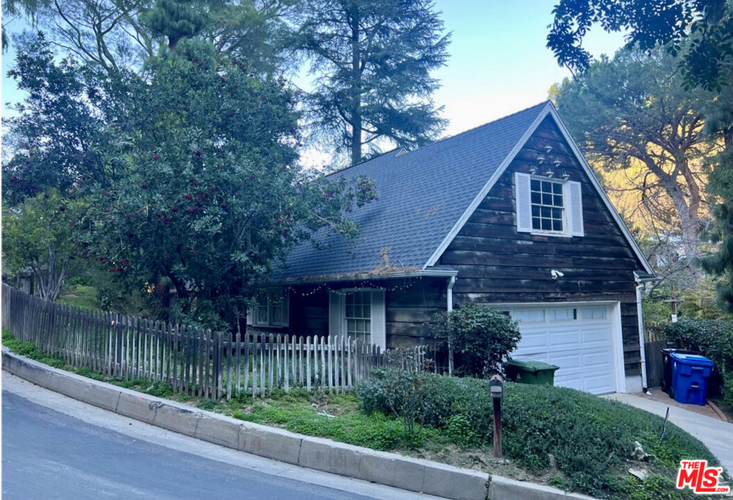 14807 Round Valley Drive Sherman Oaks, CA 91403 - Photo 5 of 25 a front view of a house with a garden