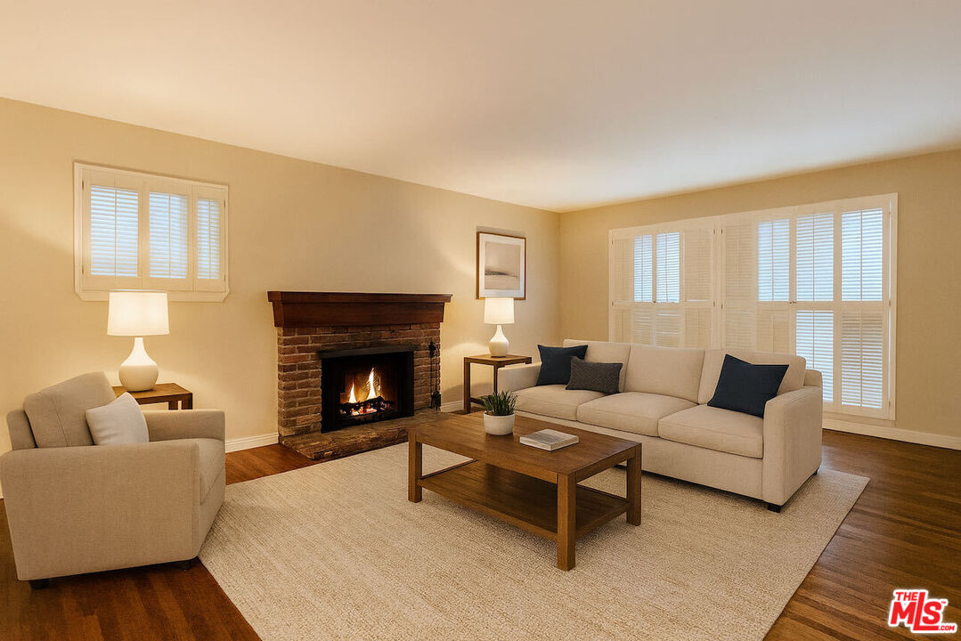 14807 Round Valley Drive Sherman Oaks, CA 91403 - Photo 7 of 25 a living room with furniture and a fireplace