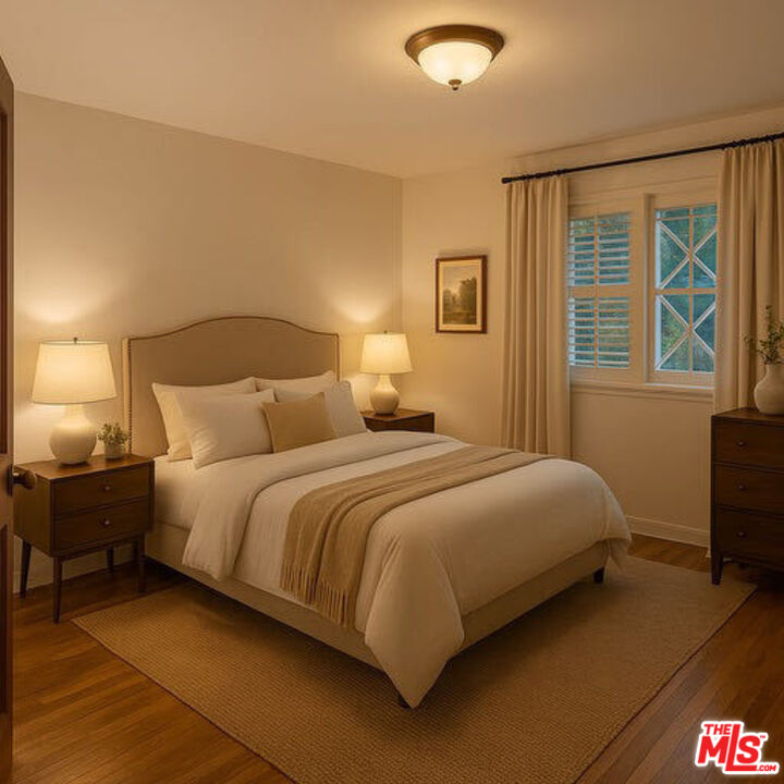 14807 Round Valley Drive Sherman Oaks, CA 91403 - Photo 9 of 25 a bedroom with a bed and window