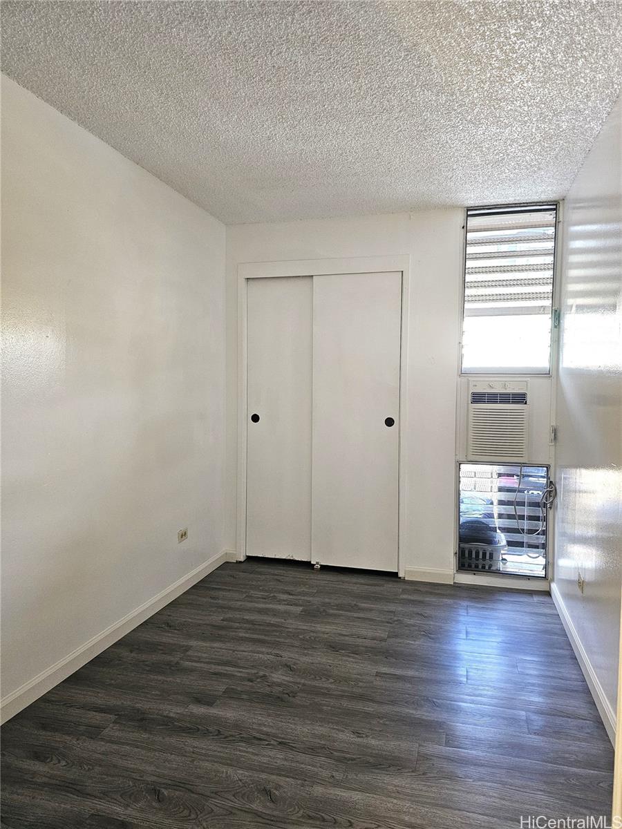 1260 Richard Lane, Unit B404 Honolulu, HI 96819 - Photo 10 of 13 a view of empty room with wooden floor