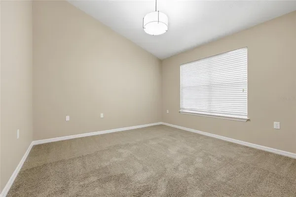 an empty room with a empty space and a window