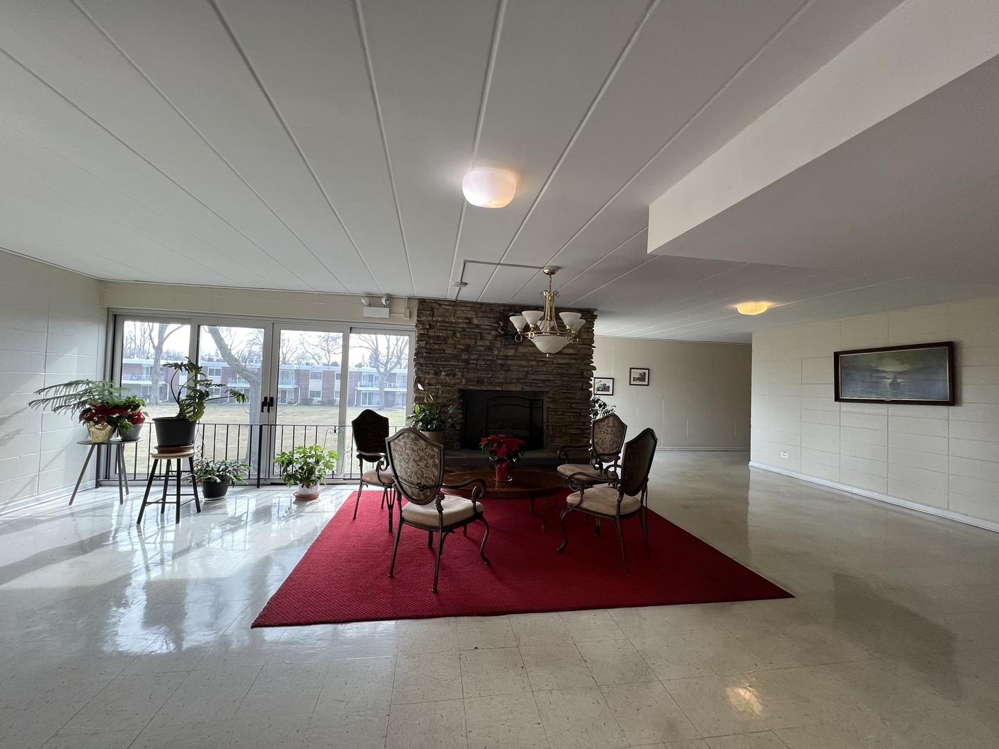 127 North Wolf Road, Unit 69B Wheeling, IL 60090 - Photo 3 of 12 a living room with furniture a dining table and a fireplace