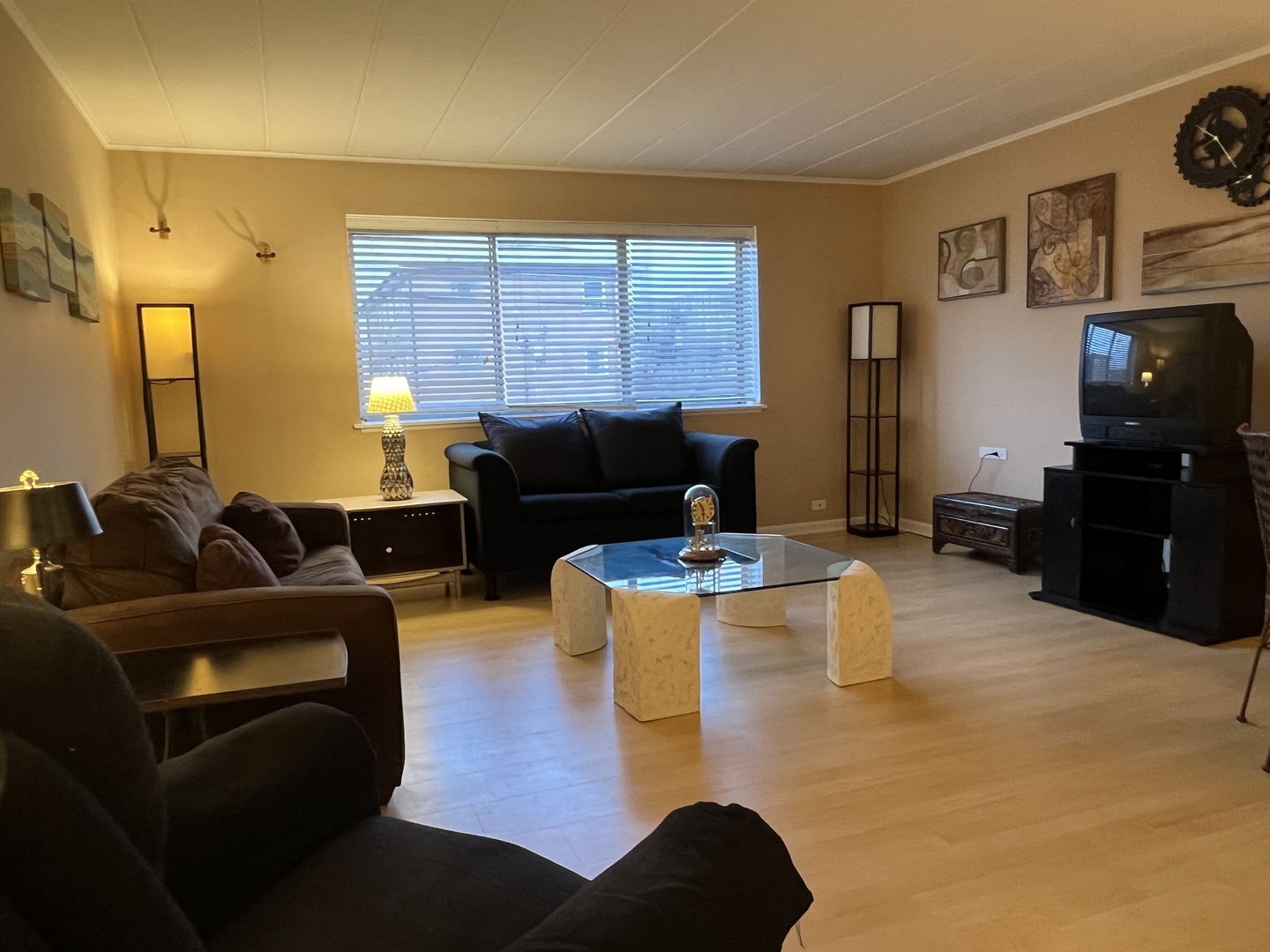 127 North Wolf Road, Unit 69B Wheeling, IL 60090 - Photo 5 of 12 a living room with furniture and a flat screen tv