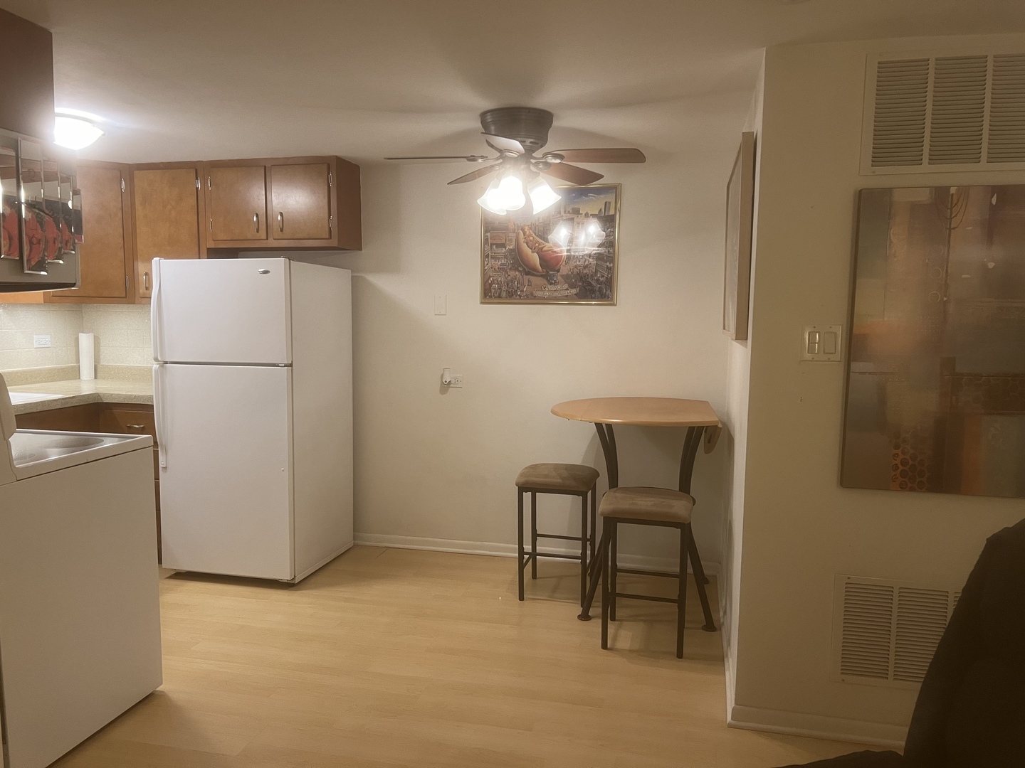 127 North Wolf Road, Unit 69B Wheeling, IL 60090 - Photo 6 of 12 a view of kitchen with furniture and refrigerator