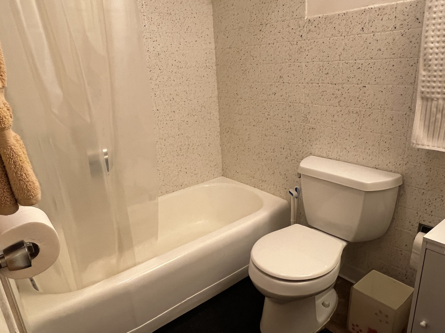 127 North Wolf Road, Unit 69B Wheeling, IL 60090 - Photo 8 of 12 a white toilet sitting next to a bath tub