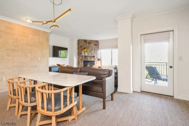 a view of a dining room with furniture and a table