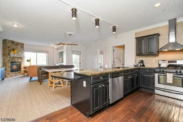 a kitchen with lots of counter top space and dining table