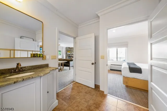 a kitchen with a refrigerator and a sink