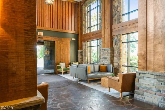 a balcony with furniture and a potted plant