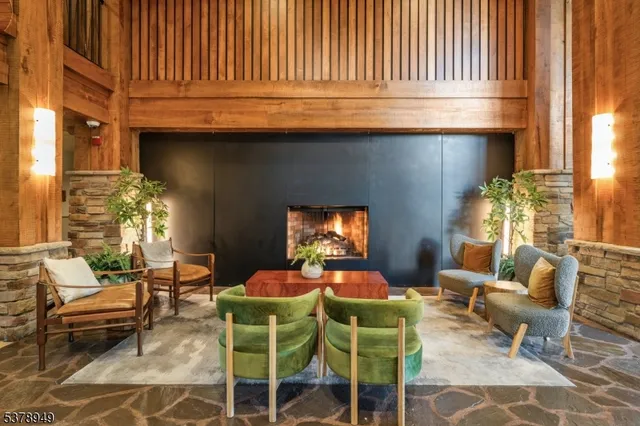 a outdoor living room with furniture and a fireplace