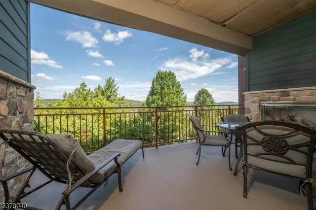 a view of a chairs and table in patio