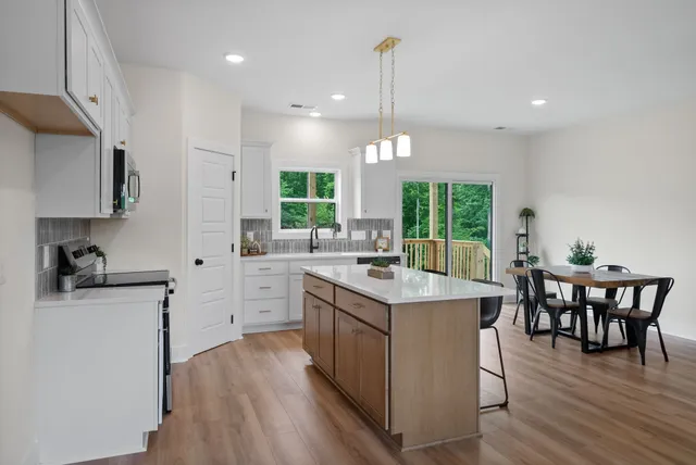 a kitchen with a sink cabinets and window