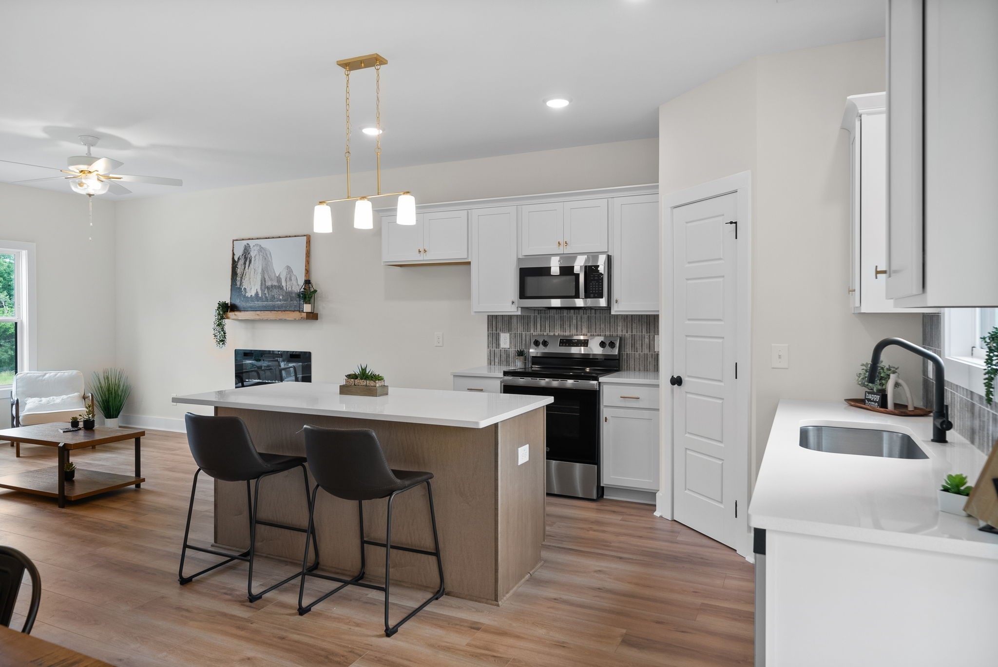 197 Dewberry Road Clarksville, TN 37042 - Photo 25 of 59 a kitchen with a sink a stove a refrigerator and cabinets