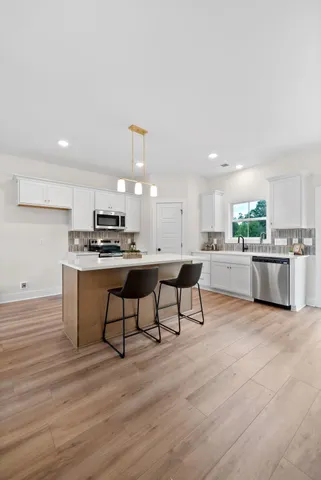 a bathroom with a window and mirror